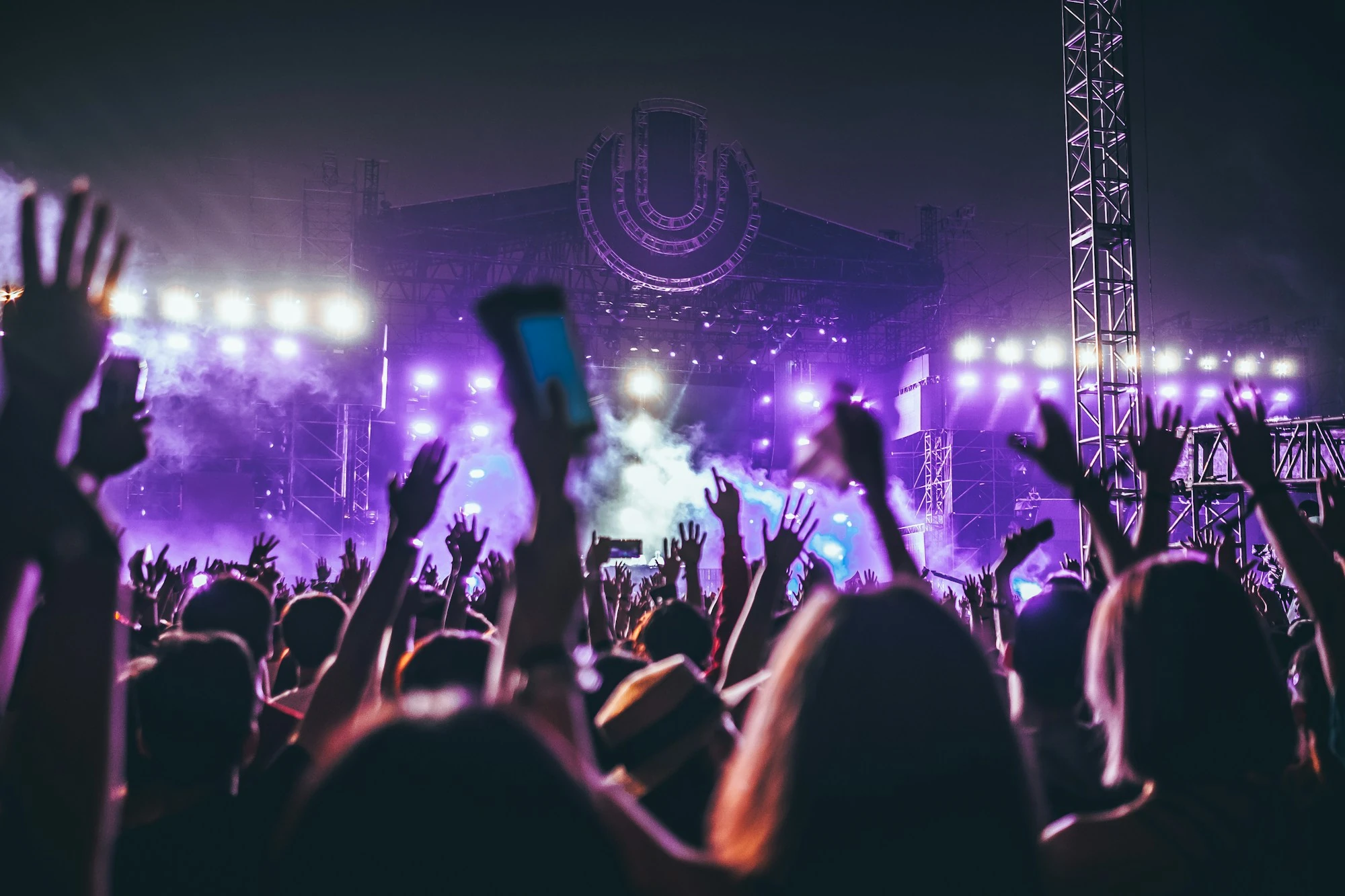 A live performance with concert lighting and an audience